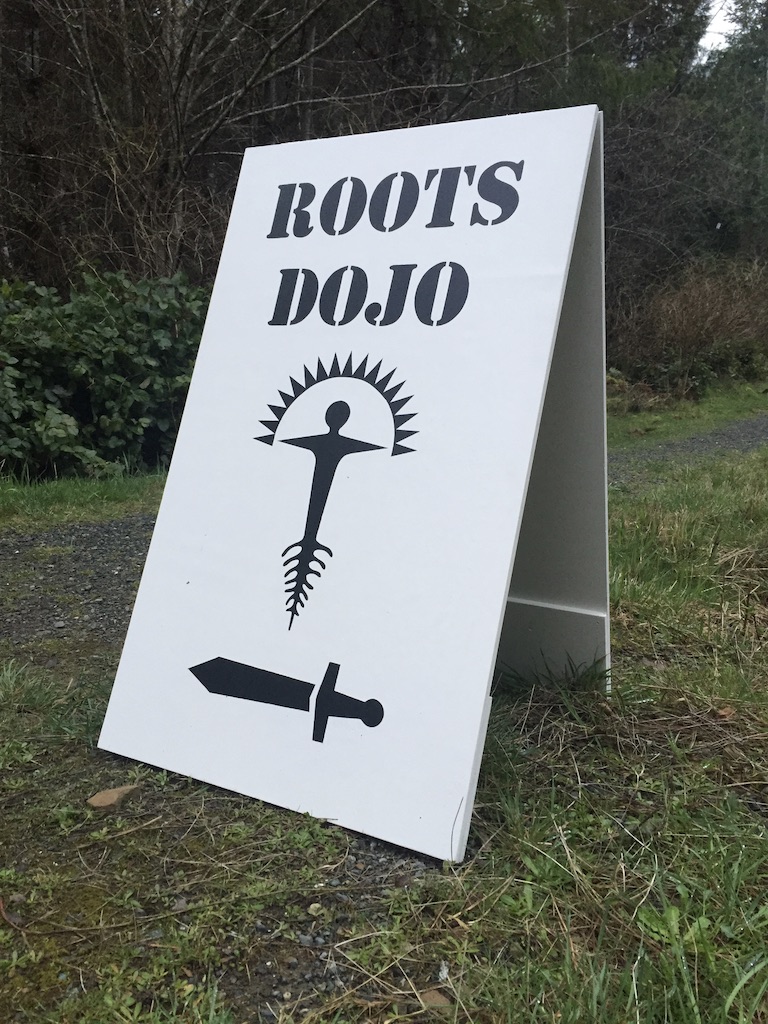 White Roots Dojo sign beside the road